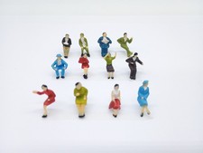 Model Train Figures Sitting