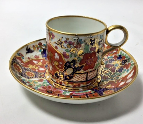 Old coffee can and saucer