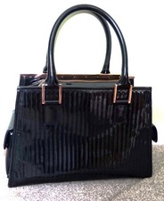Genuine Ted Baker woman's top handled black patent handbag