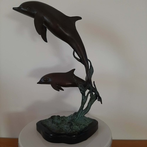 Bronze dolphin sculpture