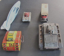 Five tin plate clock work toys