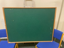 Large cork pin board, green baize cloth, wood surround