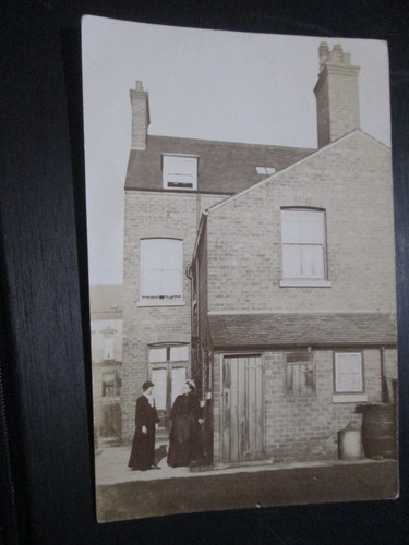 Postcard women outside house - postcard,