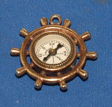 An antique brass fob compass, ship's wheel, nautical, pirate, steampunk