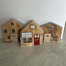 Trio Of Wooden Cottages