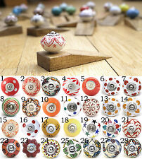 Ceramic door knob on wooden door stop.Choose your design. Bright patterns.