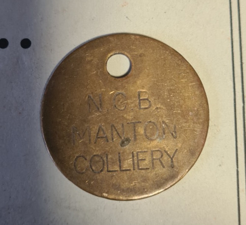 Manton brass pit check token - brass,