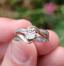 H.Samuel sterling silver and 9ct gold and 0.1 CT of diamond engagement ring. 