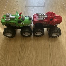 Two Large Monster Trucks with