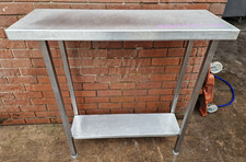 STAINLESS STEEL TALL TABLE 100 X 34.5 X 105CM HIGH, SMALL HOLES TO ENDS, £80+VAT