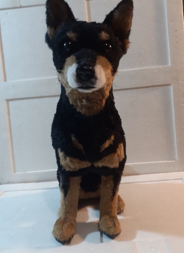 Plush stuffed pinscher dog
