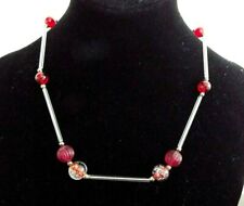 RED BEADS WITH CLEAR ACRYLIC LONG TUBES ON A 16". NECKLACE
