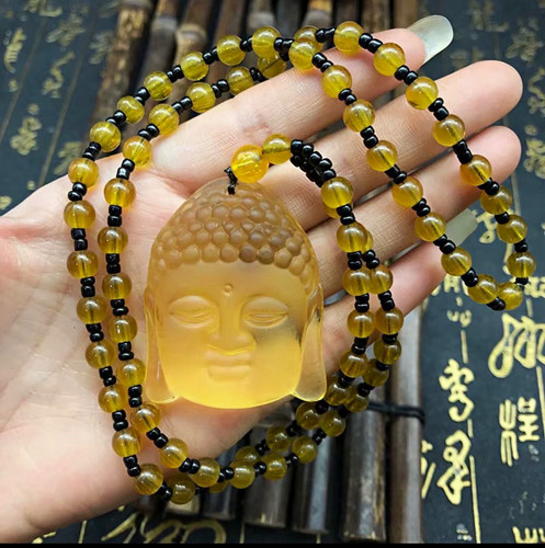 Yellow carved stone buddha - yellow,