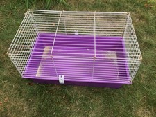Two indoor guinea pig rabbit cages