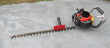 A GOOD WORKING  TF22 HEDGE TRIMMER WITH KAWASAKI ENGINE AND 28 INCH BLADE