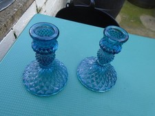 2 blue glass candle holders