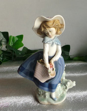 NAO BY LLADRO GIRL WITH FLOWER