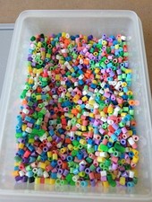 A Pot Of Used Hama Beads. Multicoloured.