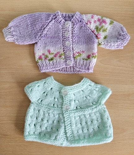 Two knitted cardigans fit - two, to