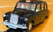 Corgi Toys #418 - AUSTIN LONDON TAXI-CAB - 2 examples, one earlier 1960