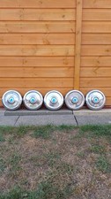 Vintage set of 5 Ford Escort Mk1 Hubcaps in good condition. Just need cleaning!