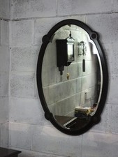 VICTORIAN MAHOGANY OVAL FRAMED WALL HANGING MIRROR. WITH FLORAL DESIGN IN CORNER