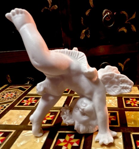 Stunning bisque putti tumbling - stunning,
