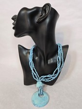 Chunky blue circle pendant on