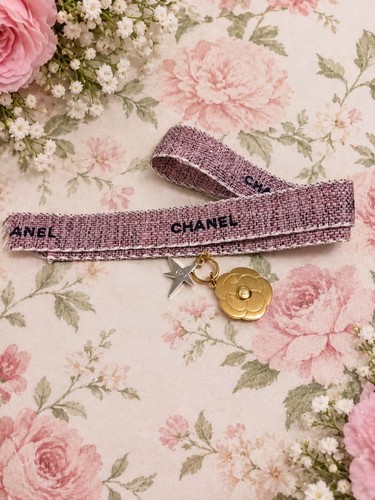 Chanel gold tone - key,
