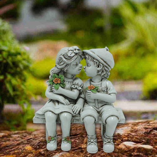 Boy and girl kissing statue - boy,