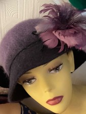 Purple hat with feathers