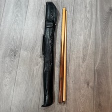 The cue is made of wood, and