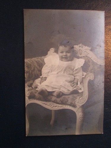 Postcard baby sat a carved - "baby, on