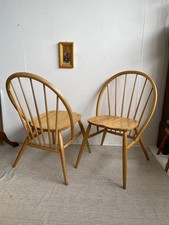 Pair of hoop back lounge dining chairs with large stick backs Ercol style