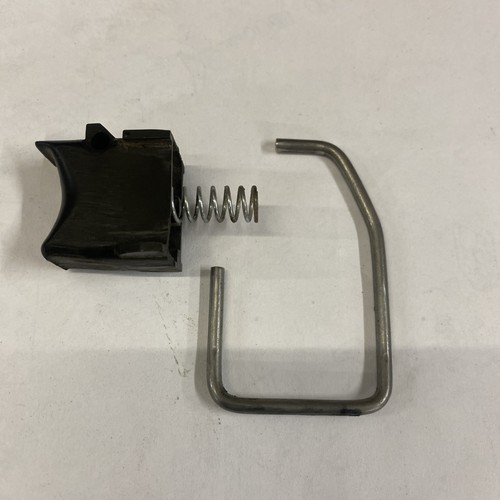 Trigger spring lock out bar - out,