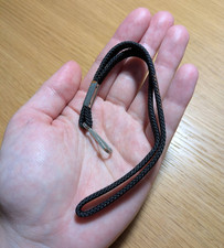 Black nylon wrist strap with trigger clip fastener for keys or camera, etc