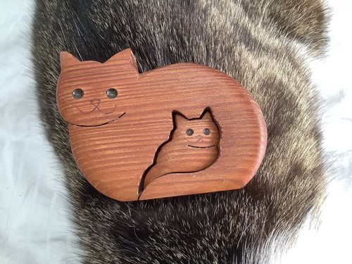 Hand carved wooden cat - hand,