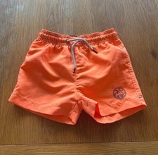 Orange swimming trunks (12-18 months)