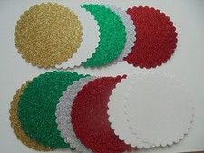20 X  DIE CUT ROUND SCALLOPED SHAPES. VIBRANT GLITTER XMAS COLOURS