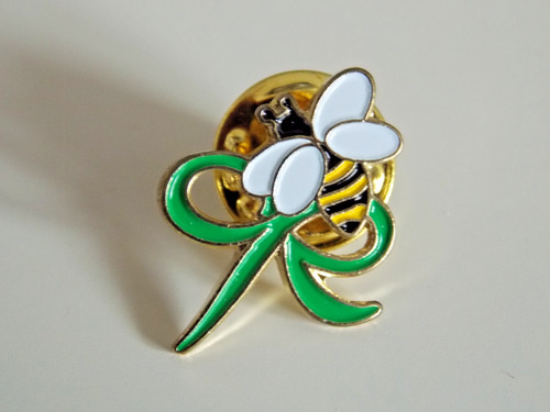 Macmillan cancer relief pin - relief,