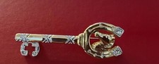 Gold plated horseshoe brooch/