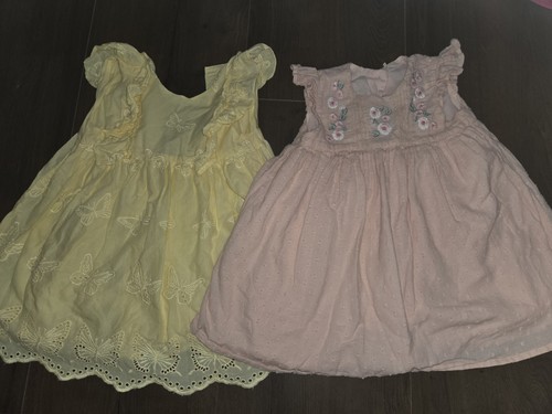 Two baby girl dresses with - two,