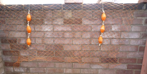 Three fishing floats on - three,