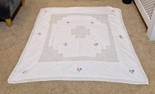 Square White Tablecloth. Embroidered With Blue And Pink Flowers.