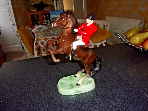 Beswick huntsman seated - seated, on