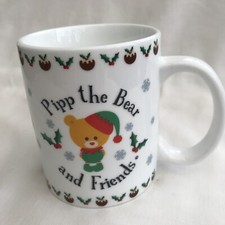 Novelty mug 'Pipp the Bear and Friends', Keel Toys, white with bear in Xmas hat