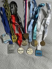 A Selection Of Half Marathon Finishers Medals From Various Places In The UK