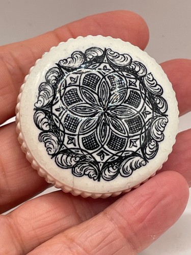 Antique porcelain bottle top