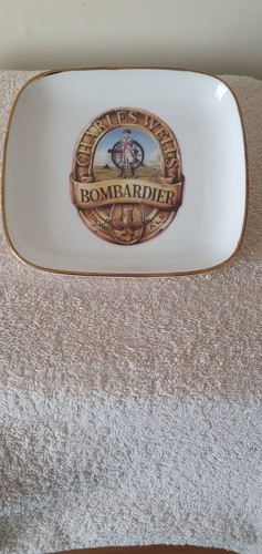 Small pottery tray featuring - a,