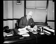 Photo:Older Man at Desk Office